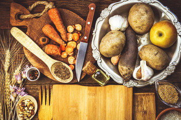 products for cooking, vegetables, ingredients, spices. place for text. wooden plank. food background.