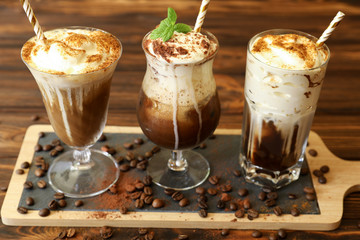 Three glasses of different cold coffee drinks.