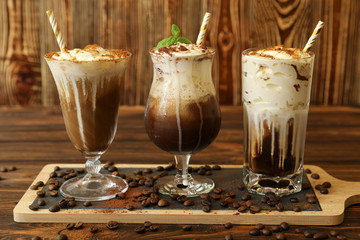 Three glasses of different cold coffee drinks.