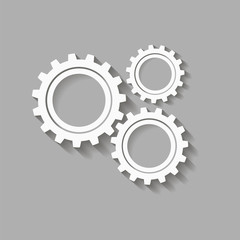 Mechanical gears with a shadow. Vector icon