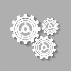 Mechanical gears with a shadow. Vector icon