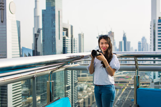 Photographer taking picture of Dubai cityscape
