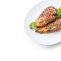 Grilled Chicken Breast with peppercorn parsley and seasame seeds isolated on white