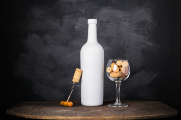 Wine bottle and glass on wooden background
