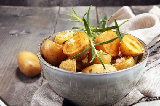Roasted potato with fresh rosemary in a bowl