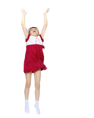 Fototapeta premium Little girl jump with her hands up.