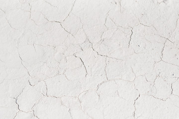 White cracked background texture, light background with dark scratch, the ground near the chalk quarry, copy space