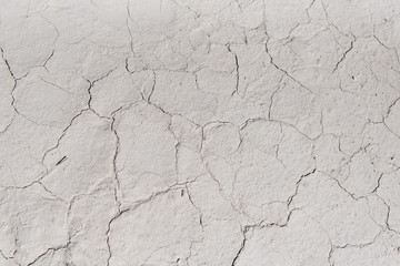 White cracked background texture, light background with dark scratch, the ground near the chalk quarry, copy space