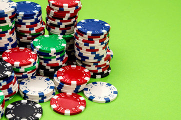 poker chips on a green table close-up