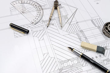 Engineer tools on drawing background, close up