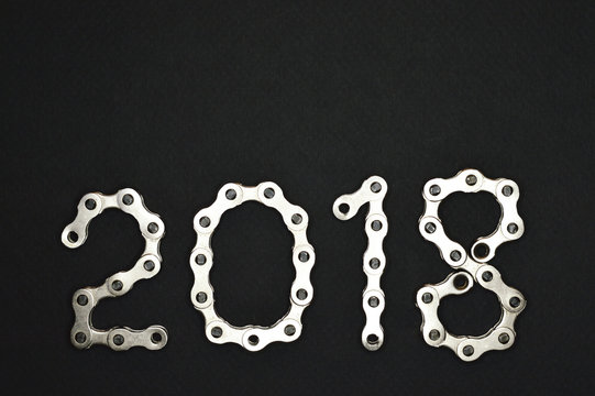 bike chain year 2018 lower section on dark background