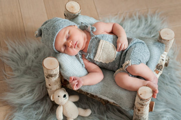 Newborn baby sleeping, asleep on bed