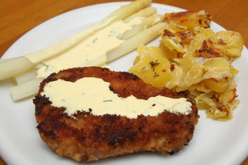 Schnitzel with asparagus and potato gratin