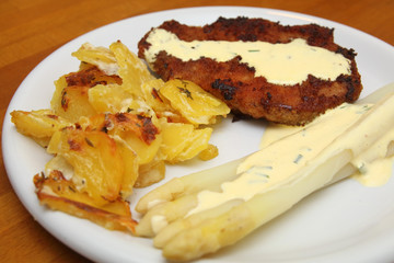 Schnitzel with asparagus and potato gratin