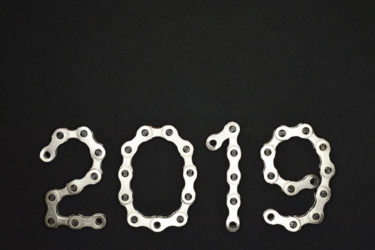 bike chain year 2019 lower section on dark background