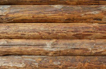Wooden logs wall texture background. Log Cabin Or Barn Unpainted Debarked Wall Textured Horizontal Background With Copy Space. Wood background texture, vintage board, rustic wood surface, rough tree.