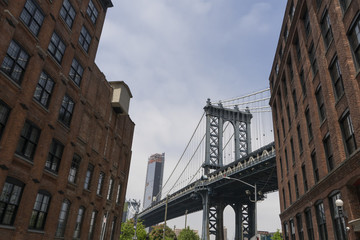 Manhattan Bridge in between buildings