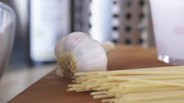 Close up, garlic and raw pasta
