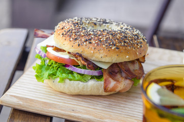 Bagel with bacon and tomato