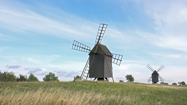 Old Wooden Windmills on Beautiful Landscape. 4K Ultra HD