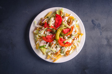 Chilli Kebab with Fries on plate top view