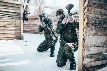 Paintball team, players in winter battle
