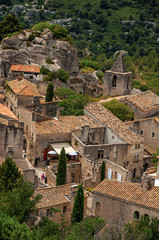 Fototapeta na wymiar View of the roofs and houses of the village of Baux-de-Provence, with the hills of Provence. Bouches-du-Rhone department, Provence-Alpes-Côte d'Azur region, southeastern France. Retouched photo