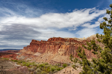 Capitol Reef National Park, Utah. Capitol Reef is a 100-mile pinch in the earth’s crust with layers of golden sandstone, canyons and striking rock formations making up a geological waterpocket fold.