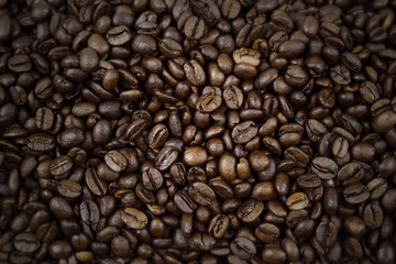 Dark roasted coffee beans background