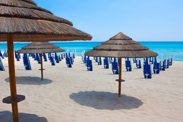 Straw umbrellas from the sun on the beach