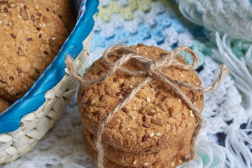 Savory cookies sprinkled with sesame seeds, sunflower on textile plaid