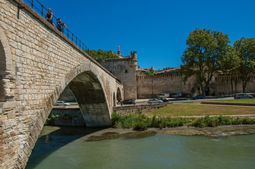 View of the arches of the Pont d'Avignon (bridge), with the historic center of the charming Avignon in the background. Vaucluse department, Provence-Alpes-Côte d'Azur region, southeastern France