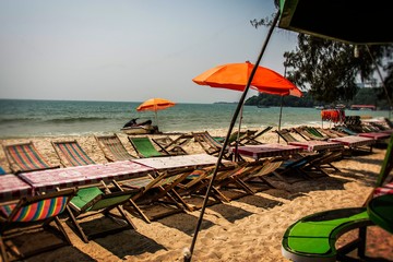 sun beds and umbrellas on ochheutal beach. Cambodia