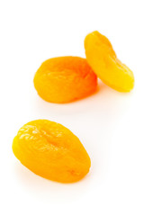 Fototapeta na wymiar Dried apricots fruit close up over white background