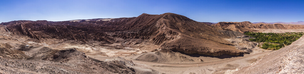 A panoramic view over the Atacama Desert valleys where some oasis can be found, Chile