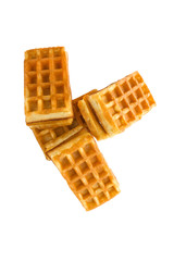 Soft waffles with a filling. Several waffles with a cream filling on a white background. Top view.
