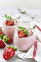 Natural strawberry yogurt with fresh berry and mint.
