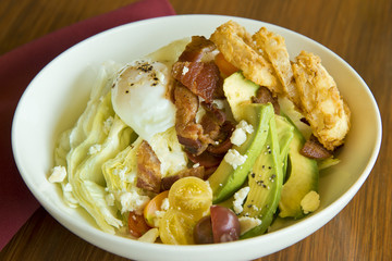 Healthy salad in a bowl with egg