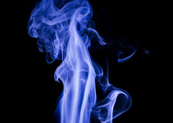 Fototapeta premium Blue smoke on black background