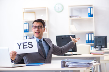 Naklejka premium Businessman in positive yes answer in the office