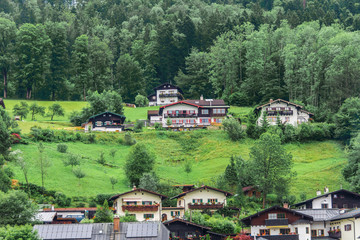 Fototapeta na wymiar Summer view of houses, hotels and restaurants in the mountains, in the Alps, Berchtesgaden.