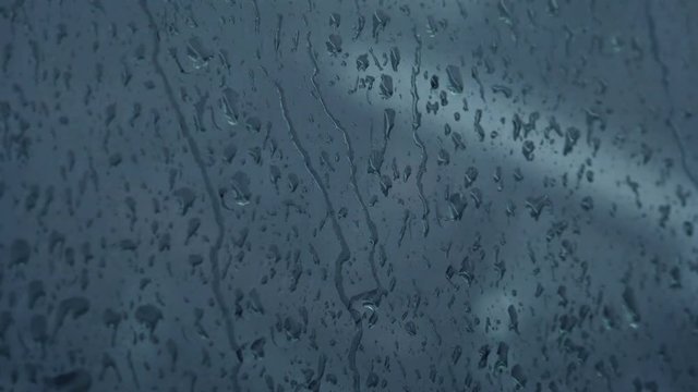 Close-up View of Rain Drops on Window. 4K Ultra HD