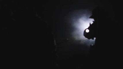 Platoon of soldiers at night with weapons drawn