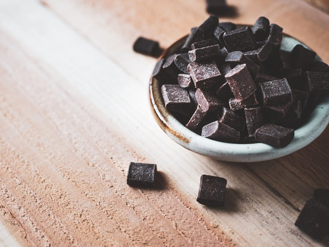 Dark Chocolate Chunks In Ceramic Bowl