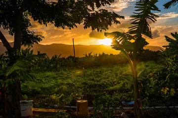 Breathtaking sunset view over the Pacific ocean at the Kauai island, Hawaii with clouds and...