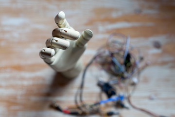 prosthetic robotic hand on table being fixed