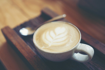 Cup of coffee latte in coffee shop