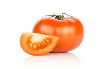 Red tomato and one slice isolated on white background.
