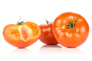 Two red tomato one half isolated on white background.