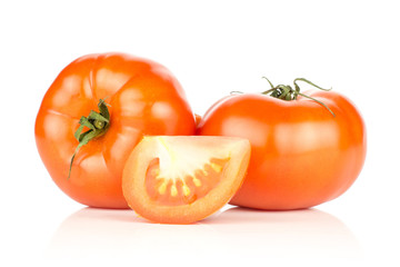 Two red tomatoes and one slice isolated on white background fresh.